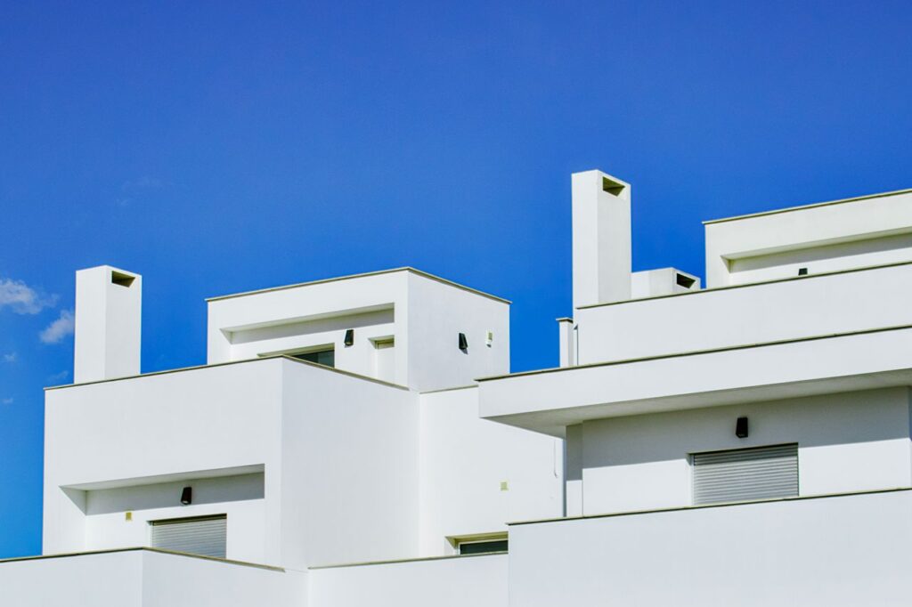 Sleek white buildings with blue sky backdrop in Torrevieja, Spain.